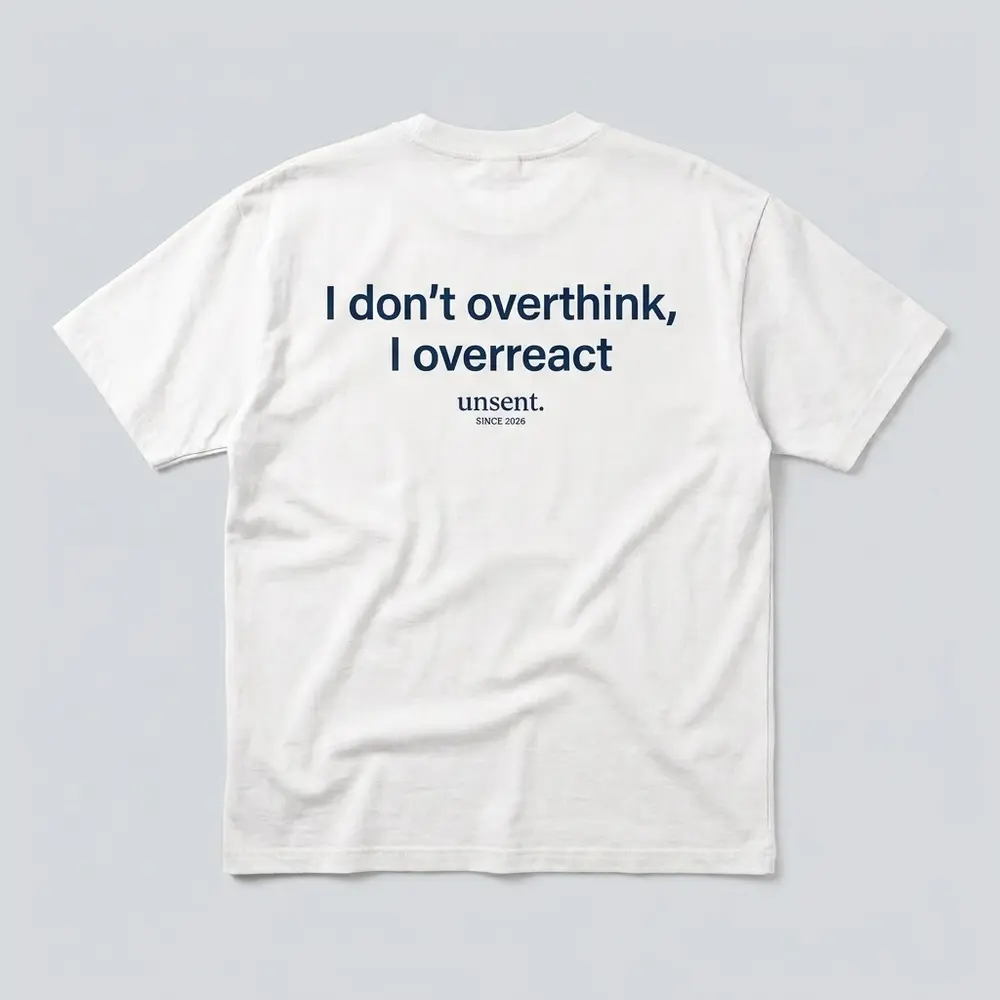 White tee, navy print on the back: I don’t overthink, I overreact